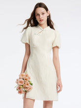 a woman in white mandarin collar dress
